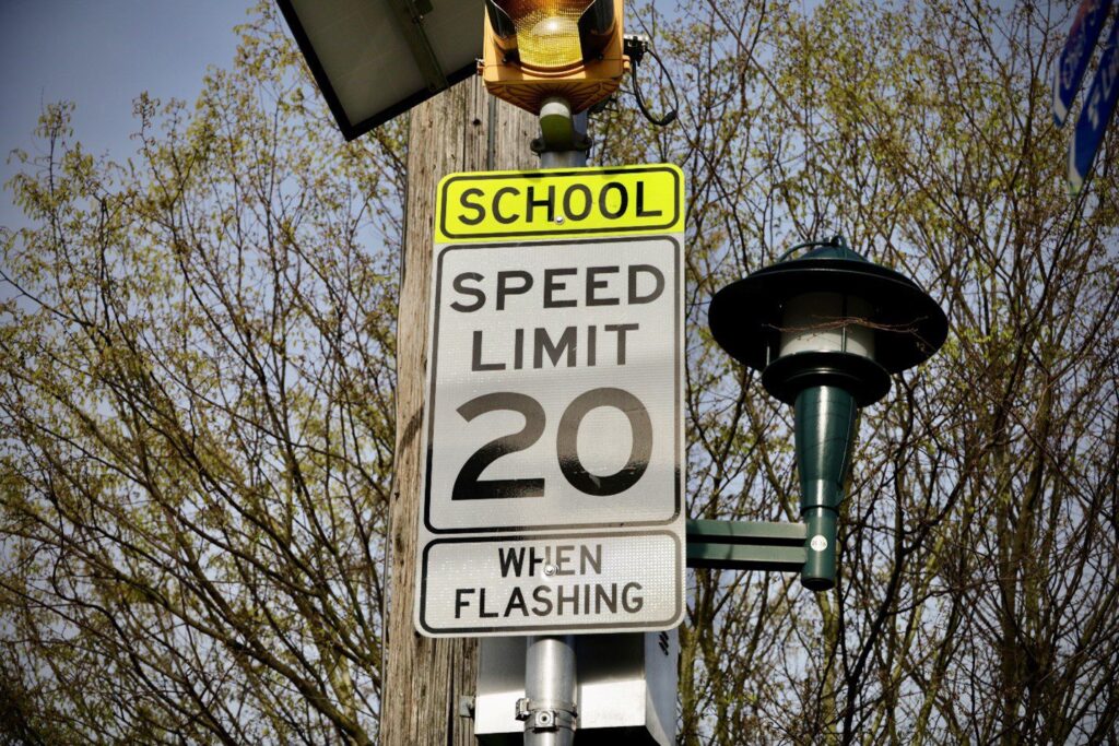 Example of a school zone speed limit sign and flashing yellow beacon. Photo Credit: Seattle Department of Transportation